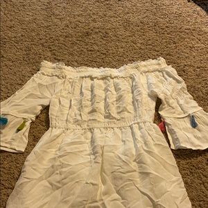 white mini dress with colorful tassels